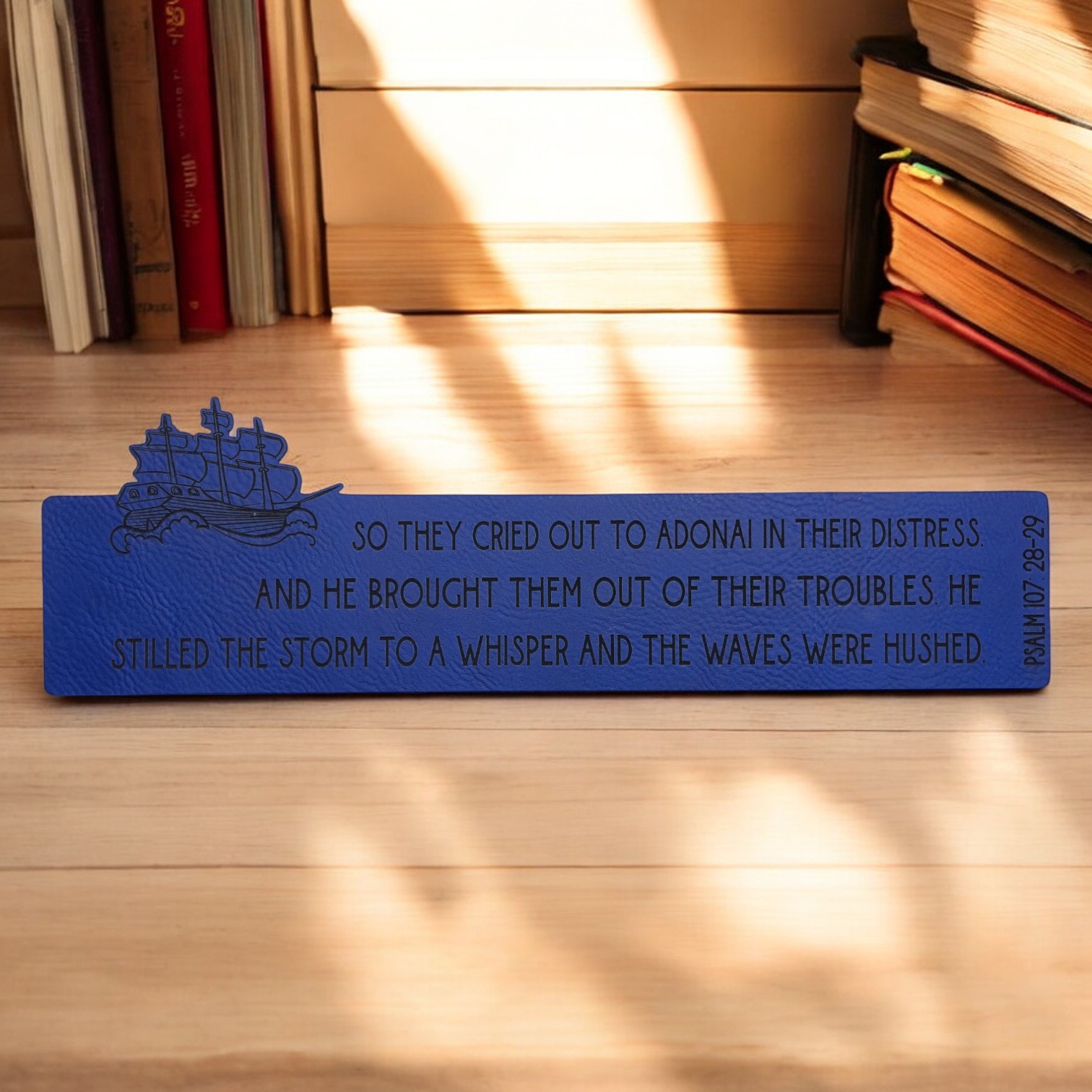 'Psalm 107:28-29' - Custom Laser Engraved on a Blue Leatherette Bookmark